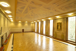 A large brightly lit hall with high ceilings and period details