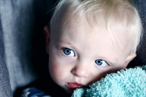 a blond baby with blue eyes