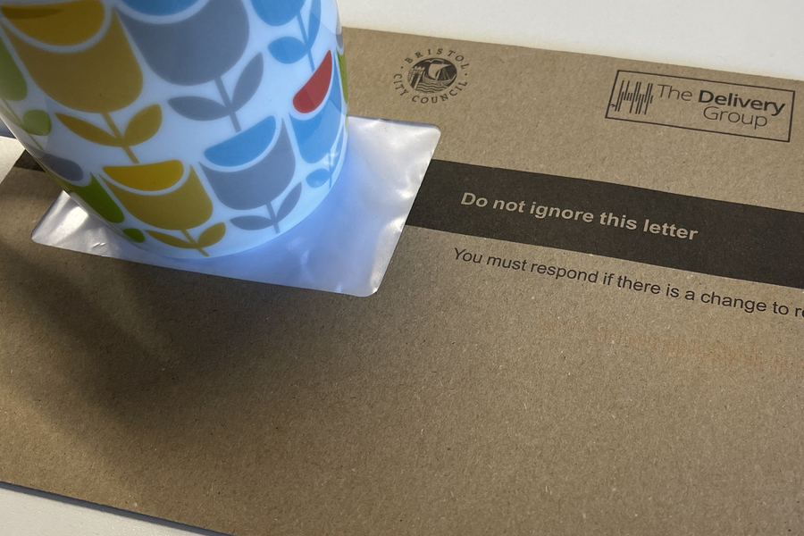 a brown envelope with a colour cup on it