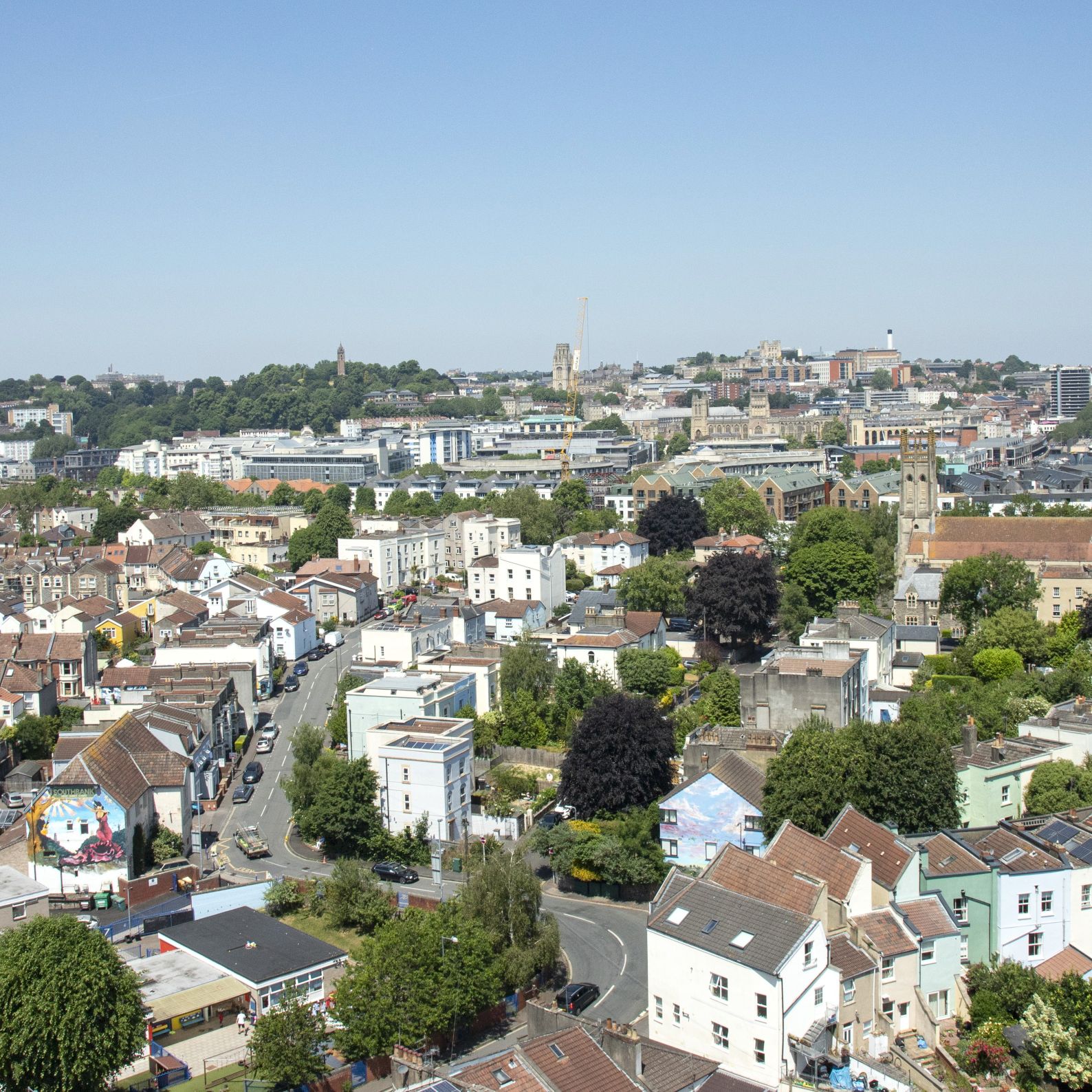 Cityscape view of Bristol showing buildings and trees across a wide area.