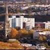 Skyline shot of bristol council residential buildings alongside a local church