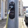 Electric vehicle charger fitted into a lamppost on the street