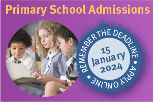 Three students reading a book.