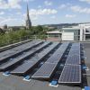 Solar panels on the roof of the Bristol City Council Temple Street office building with view of the city in the background
