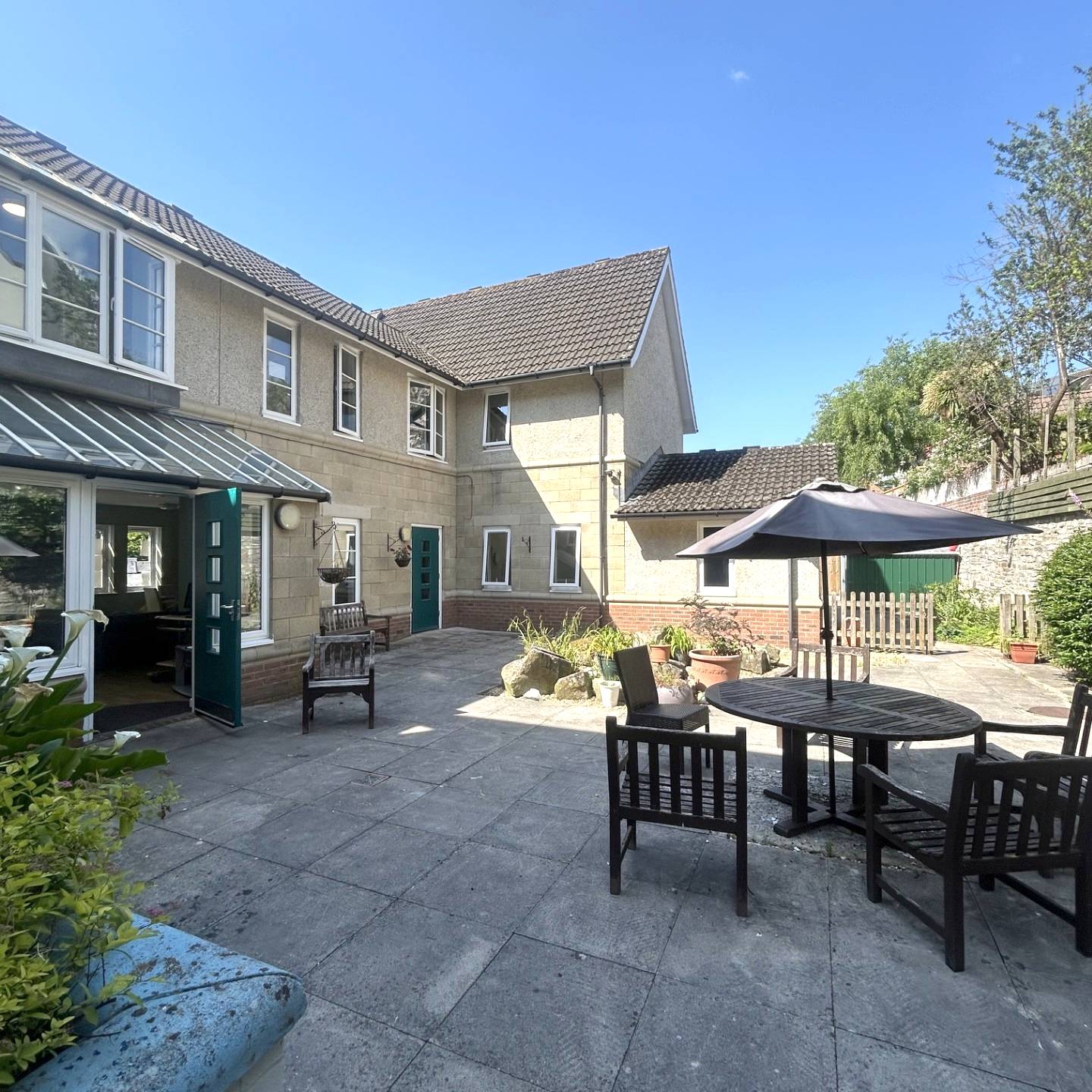 Back garden with table and chairs