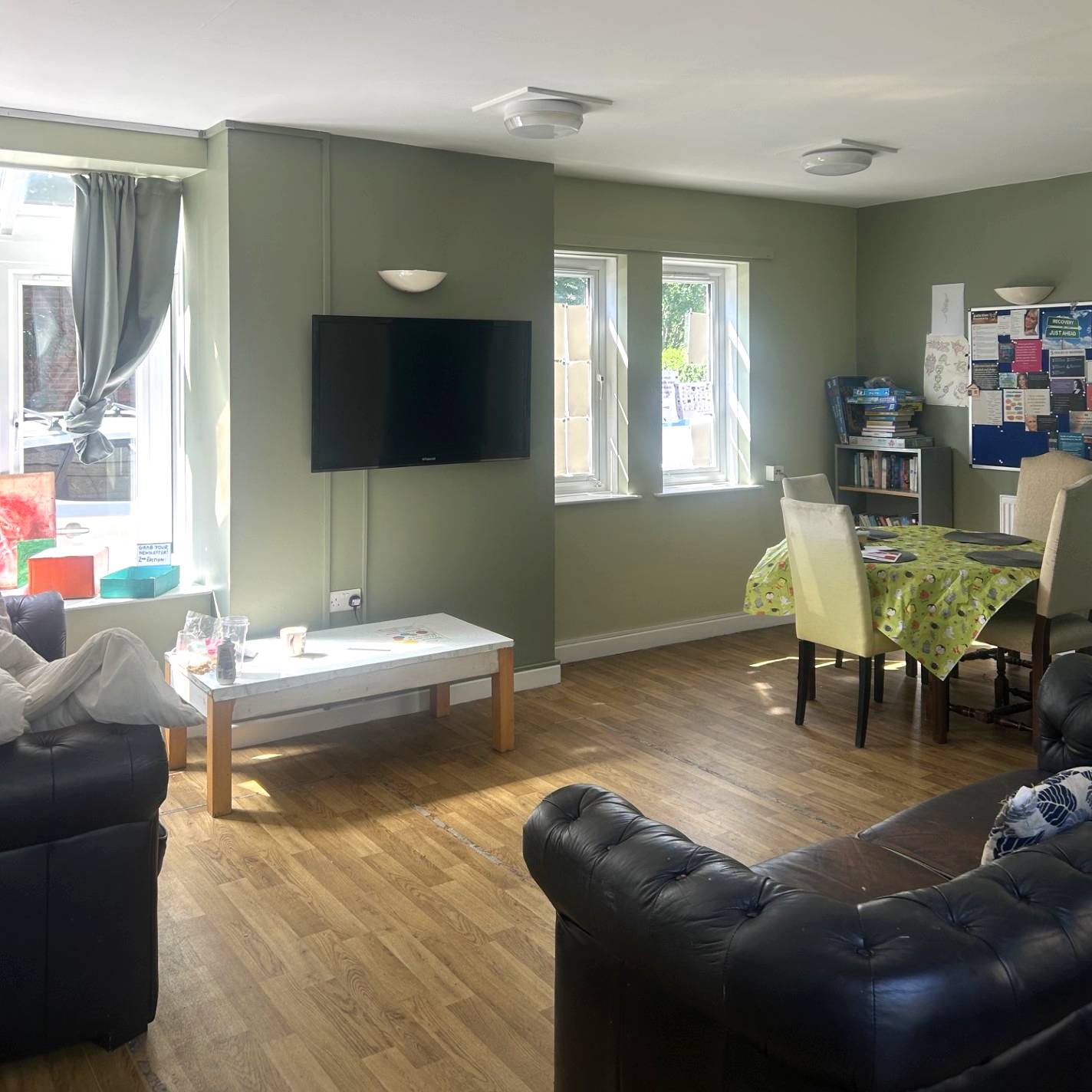 Communal lounge with sofas and TV