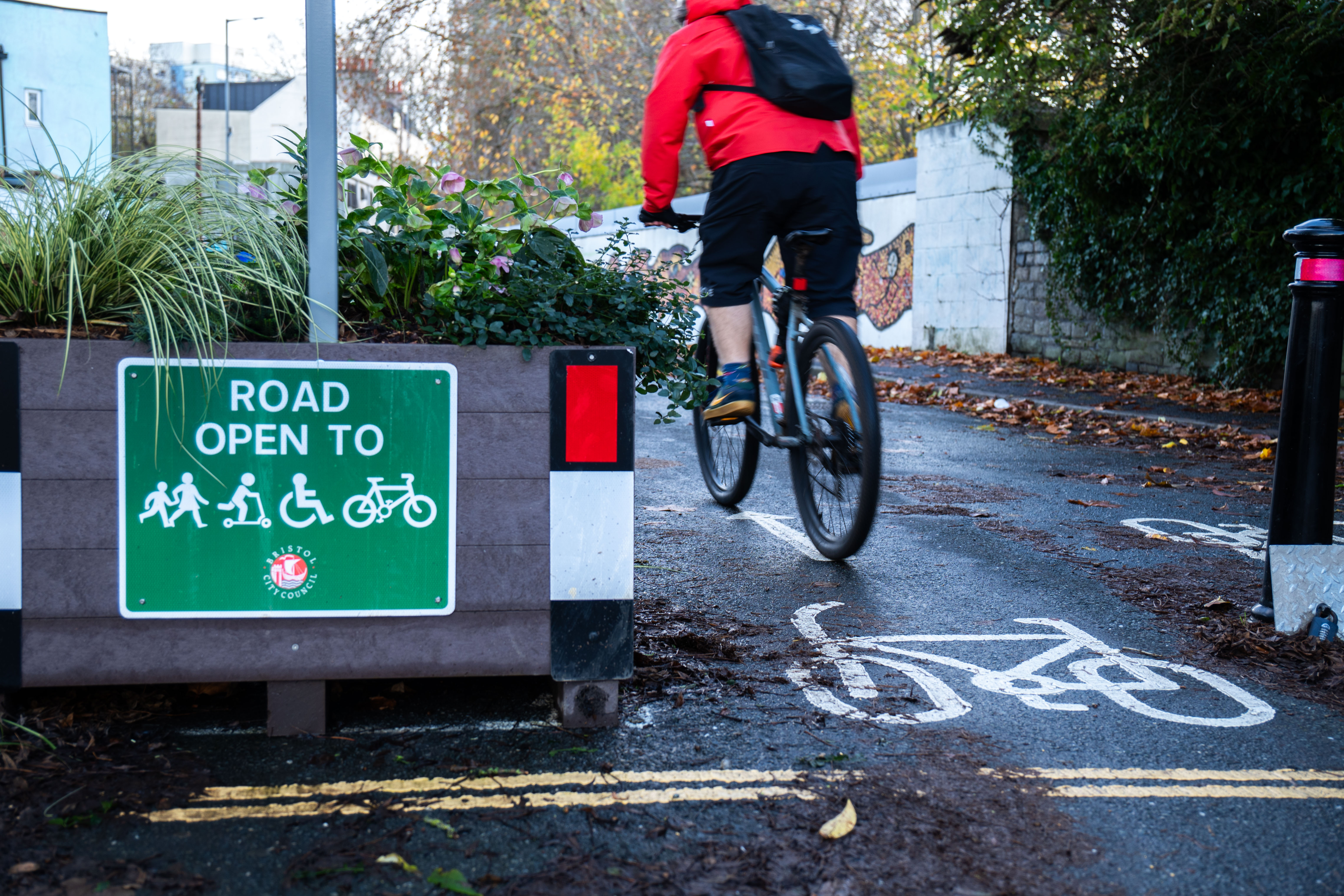 Cyclist using a dedicated cycle path within the East Bristol Liveable Neighbourhood