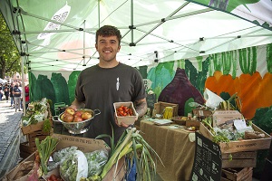 man holding somne fruit