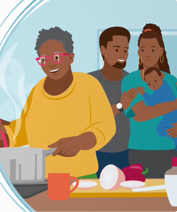 Parents holding baby watching woman cooking