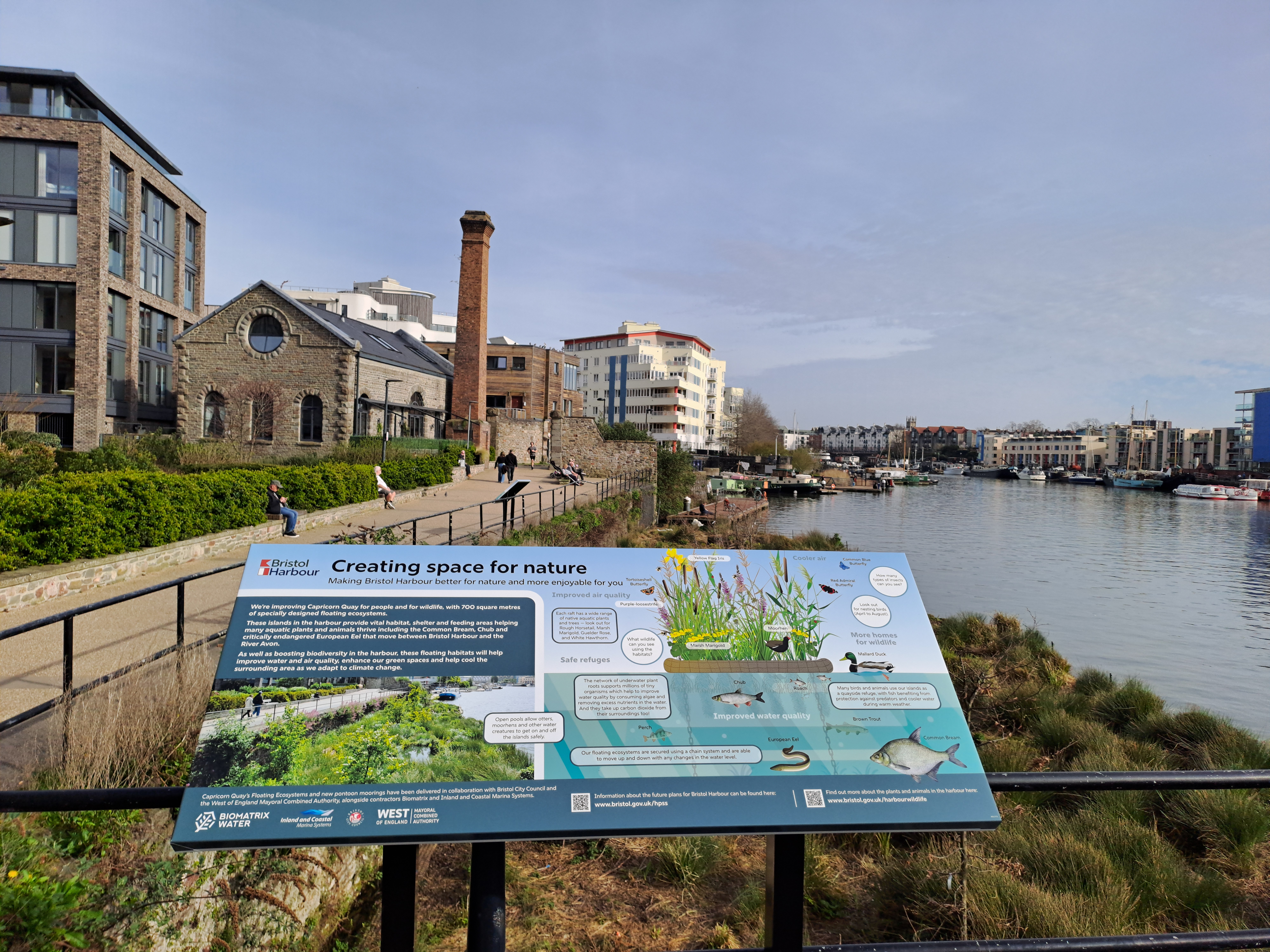 An information board overlooking the harbour