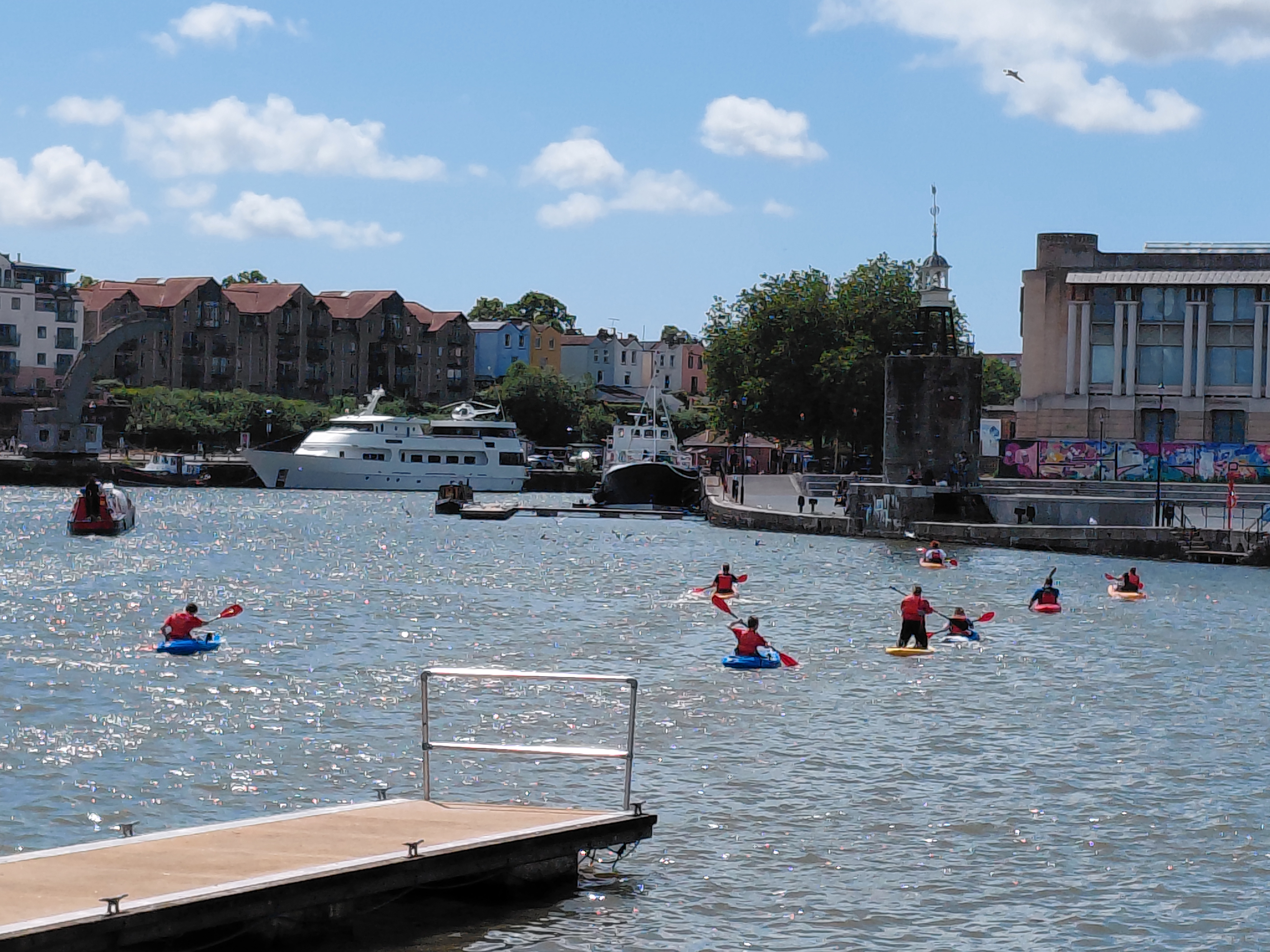 People in the harbour in kayaks 