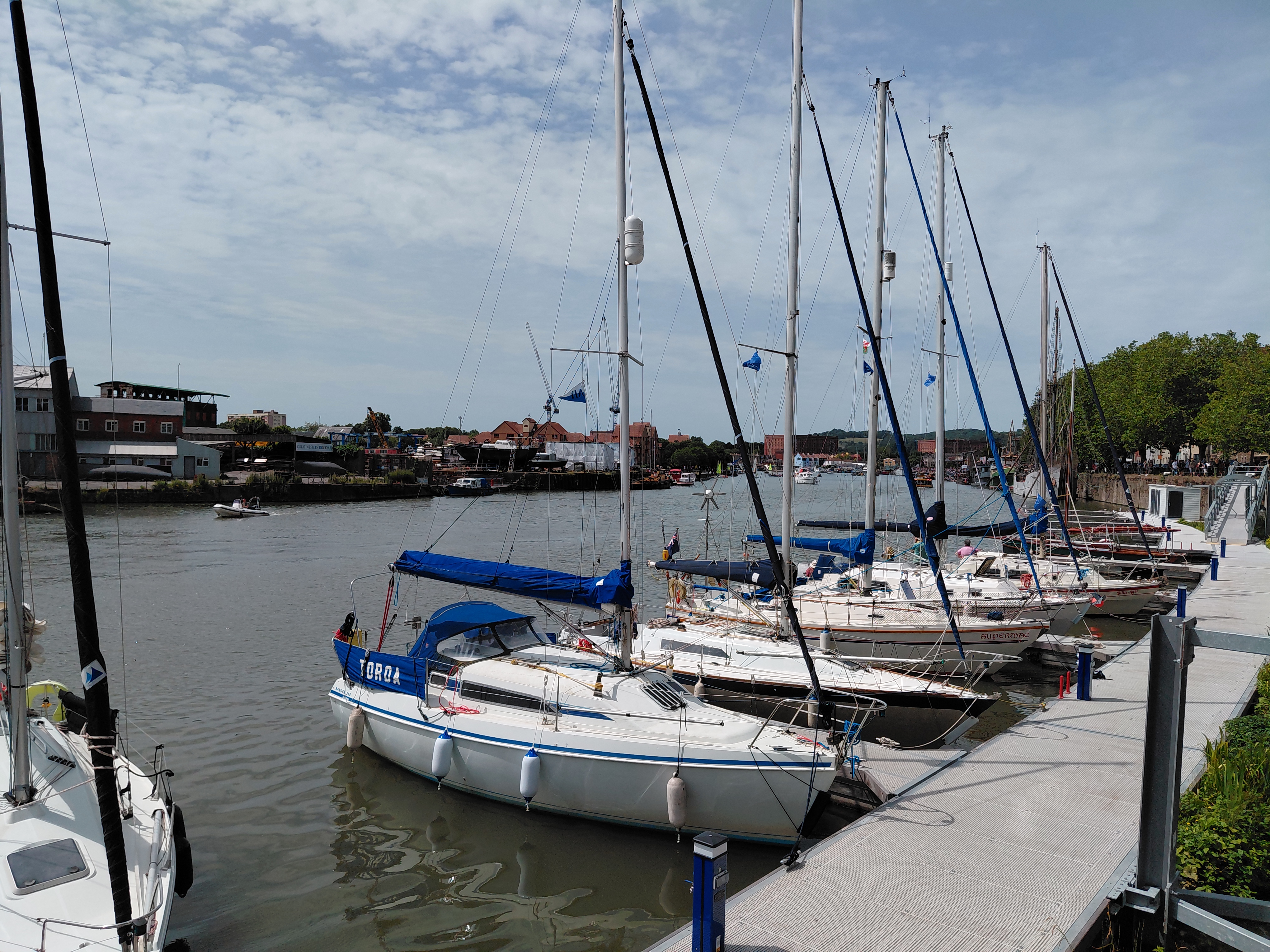 A row of boats moored together 