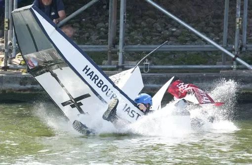 A 'flying' boat with 'Harbour Master written on it, in the water