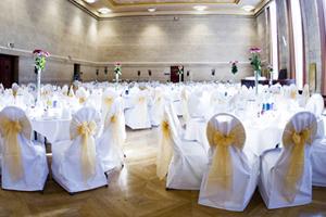 A room set up cabaret-style for a wedding reception