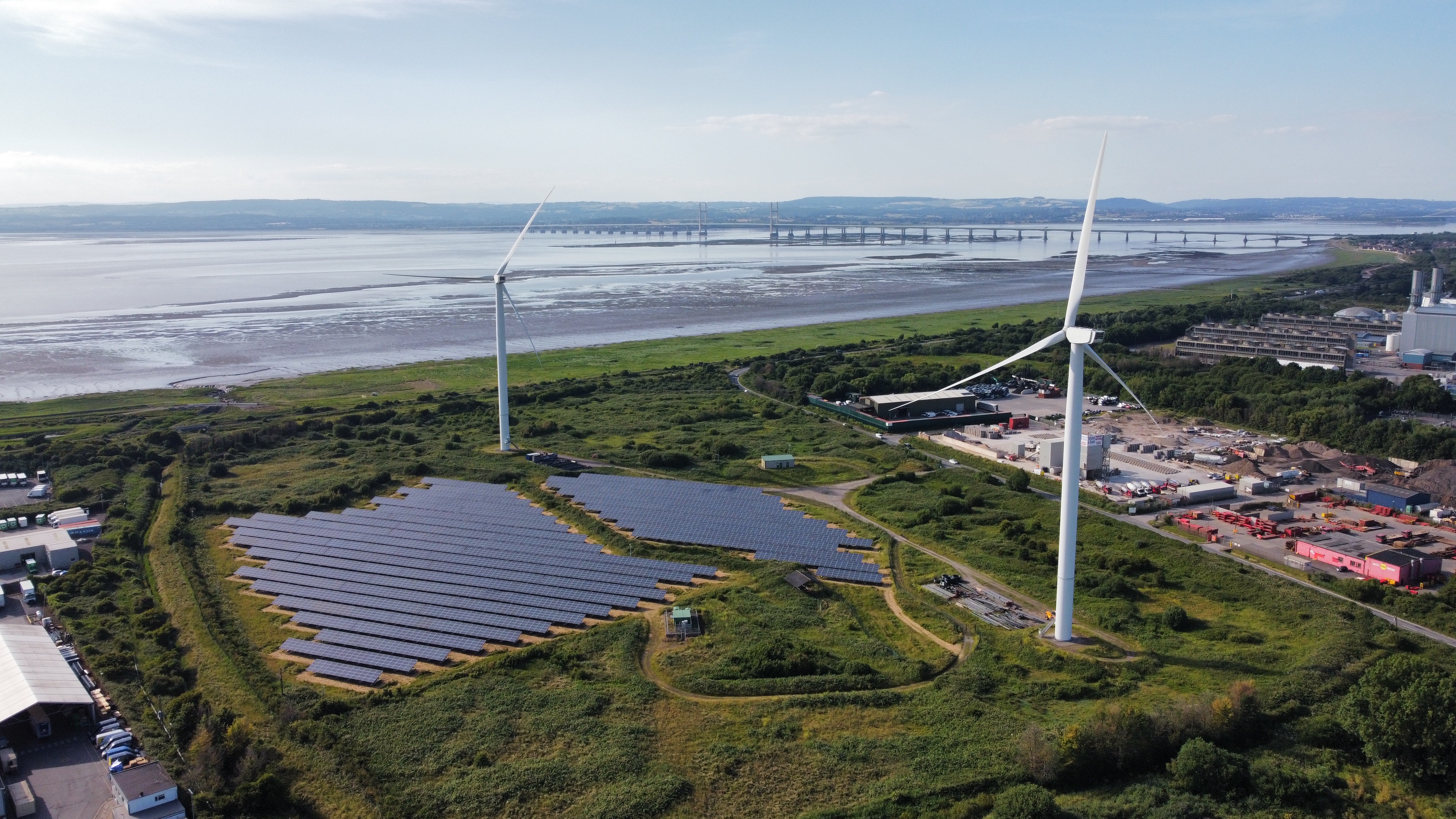 A view of Avonmouth bay with a solar farm and wind turbines