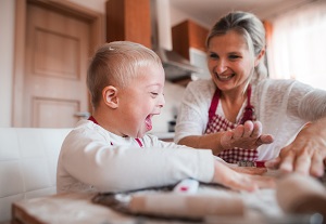 A woman and young boy smiling