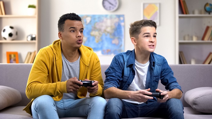 Two teenage boys playing computer games