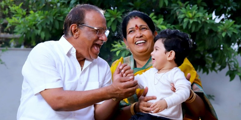Carers and boy laughing