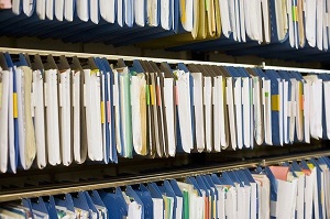 Files in rows on three shelves