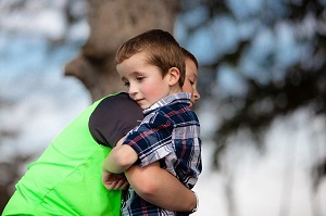 Two boys hugging