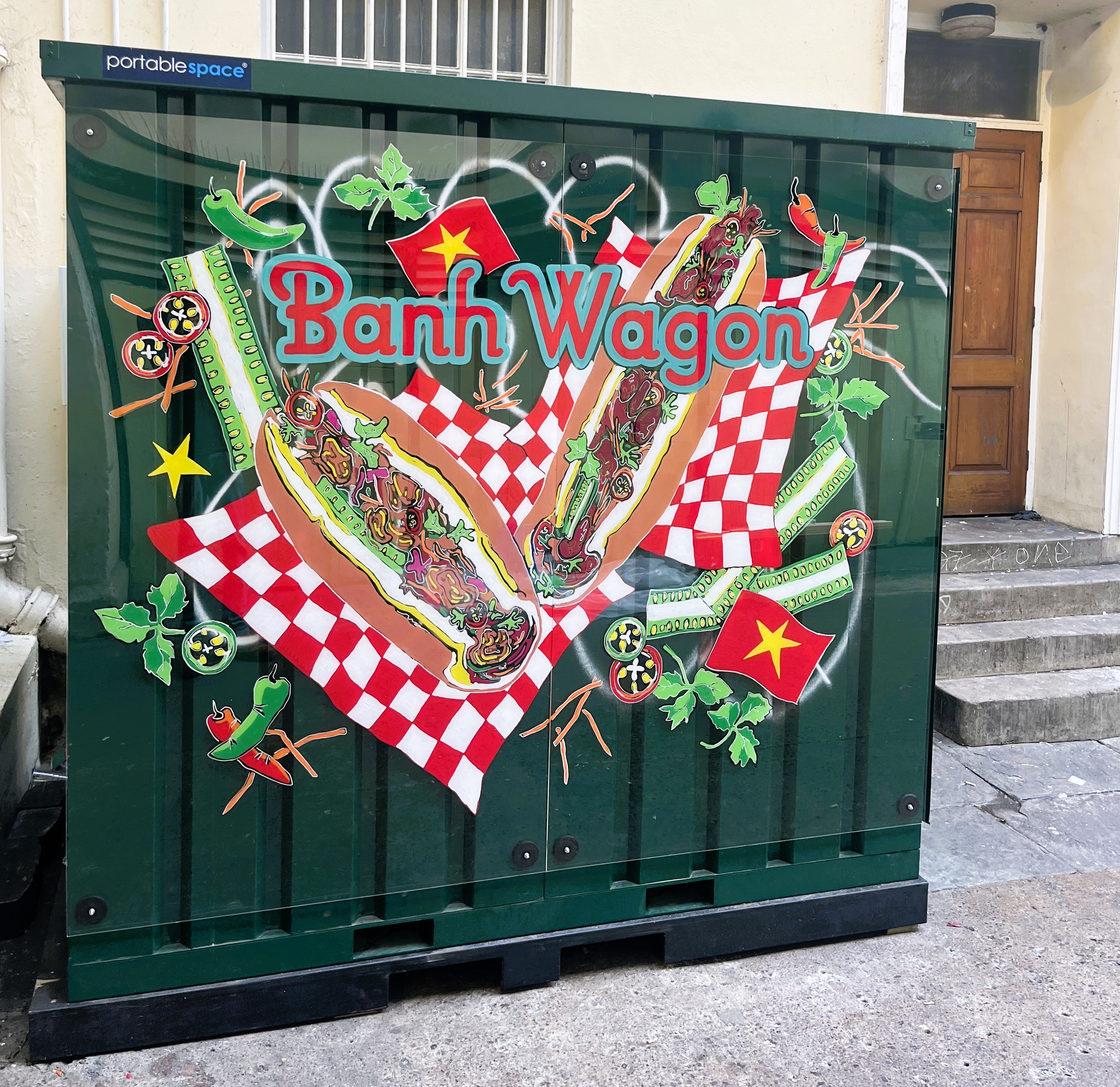 The Bahn Wagon stall. Th exterior is green and is has their colourful logo on it