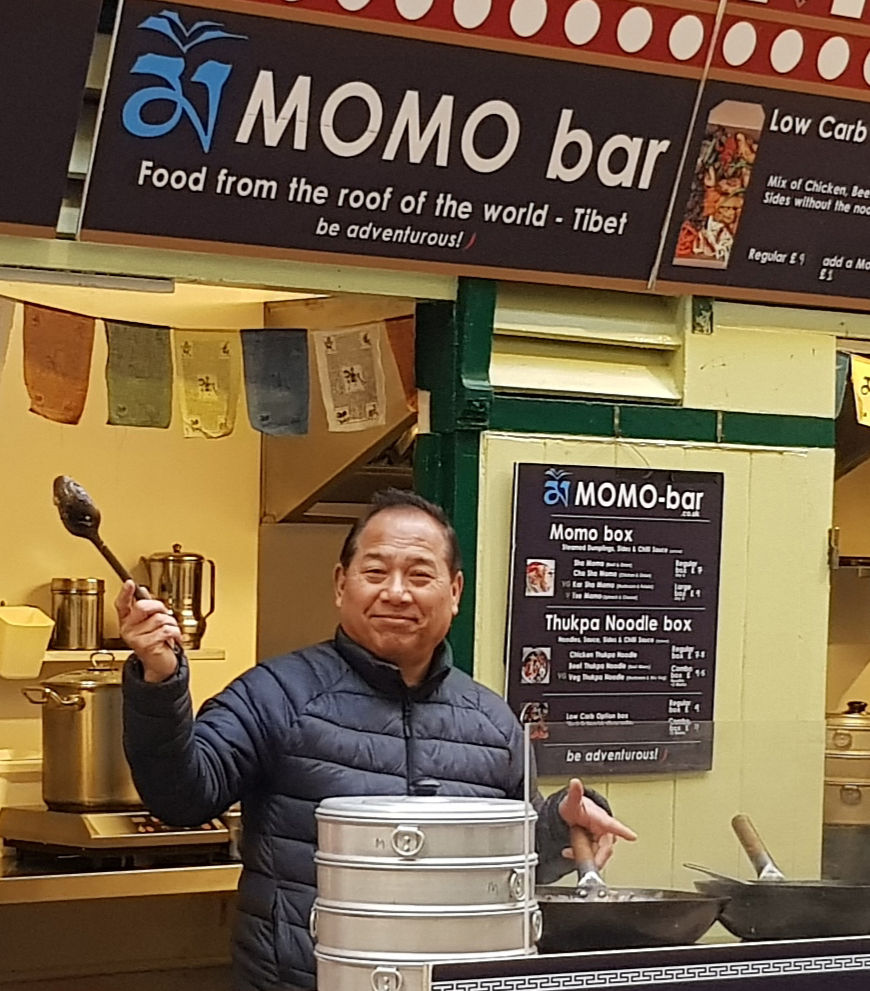Momo bar staff waving at the camera