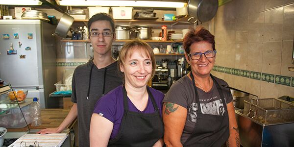 Two ladies and a man in a kitchen