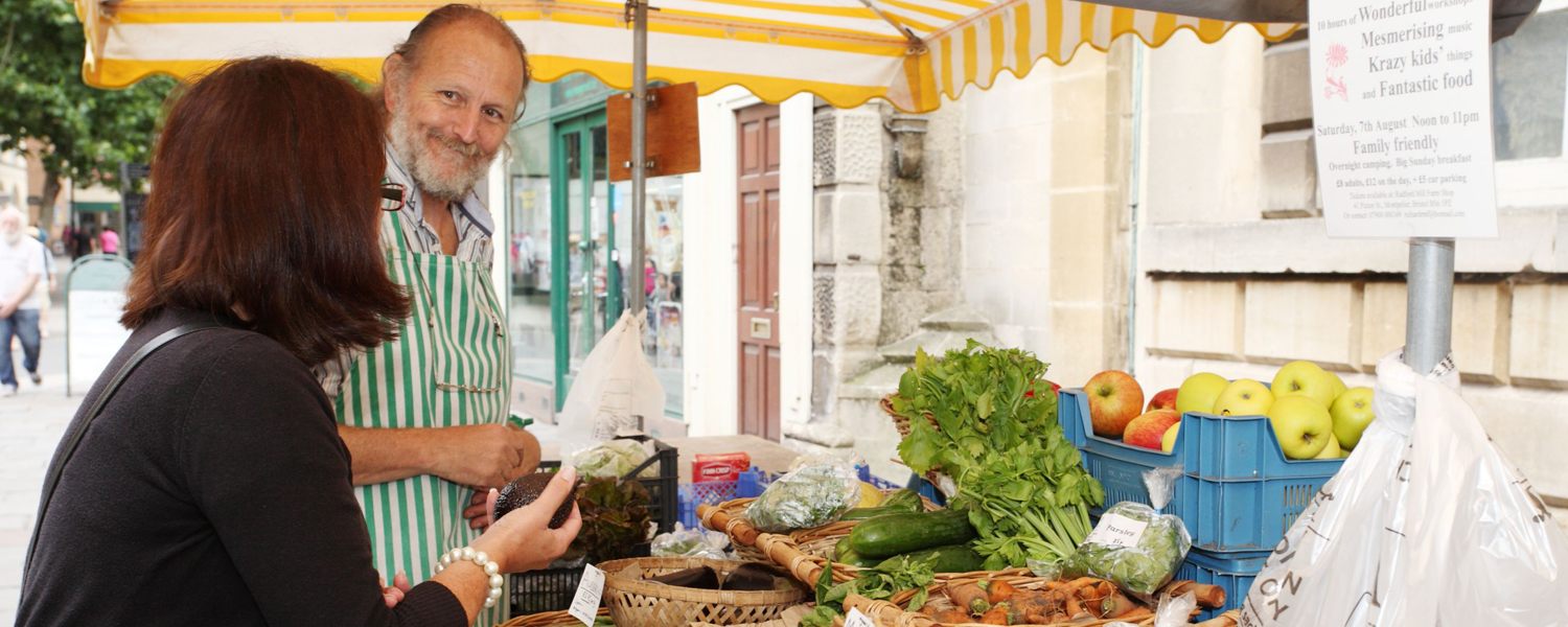 A market seller with a customer