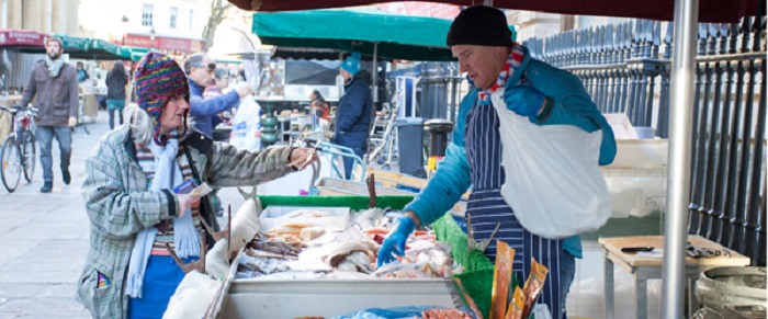 A woman buying fish at the market