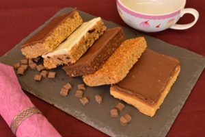 Some flapjacks and other cakes on a plate