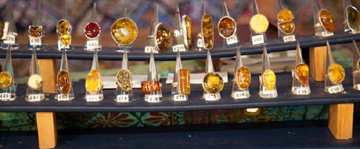 Silver and amber rings for sale on a market stall