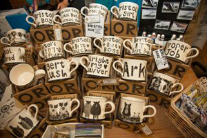 Some printed mugs in a shop