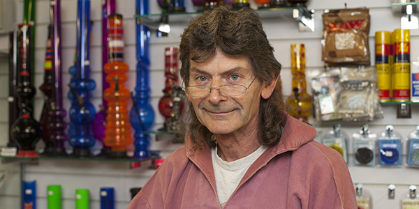 A man in a shop with smoking paraphernalia