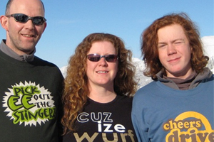 Two men and a lady wearing t-shirts