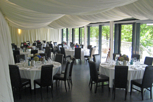 A room set up cabaret-style for a wedding reception